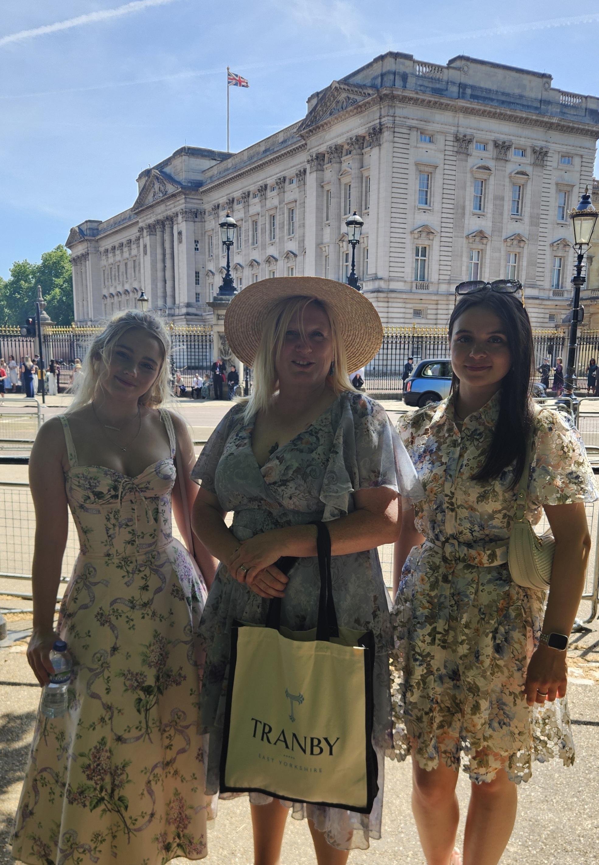 Mrs Smith with Gold Award pupils Annabel (L) and Ruby (R) at Buckingham Palace